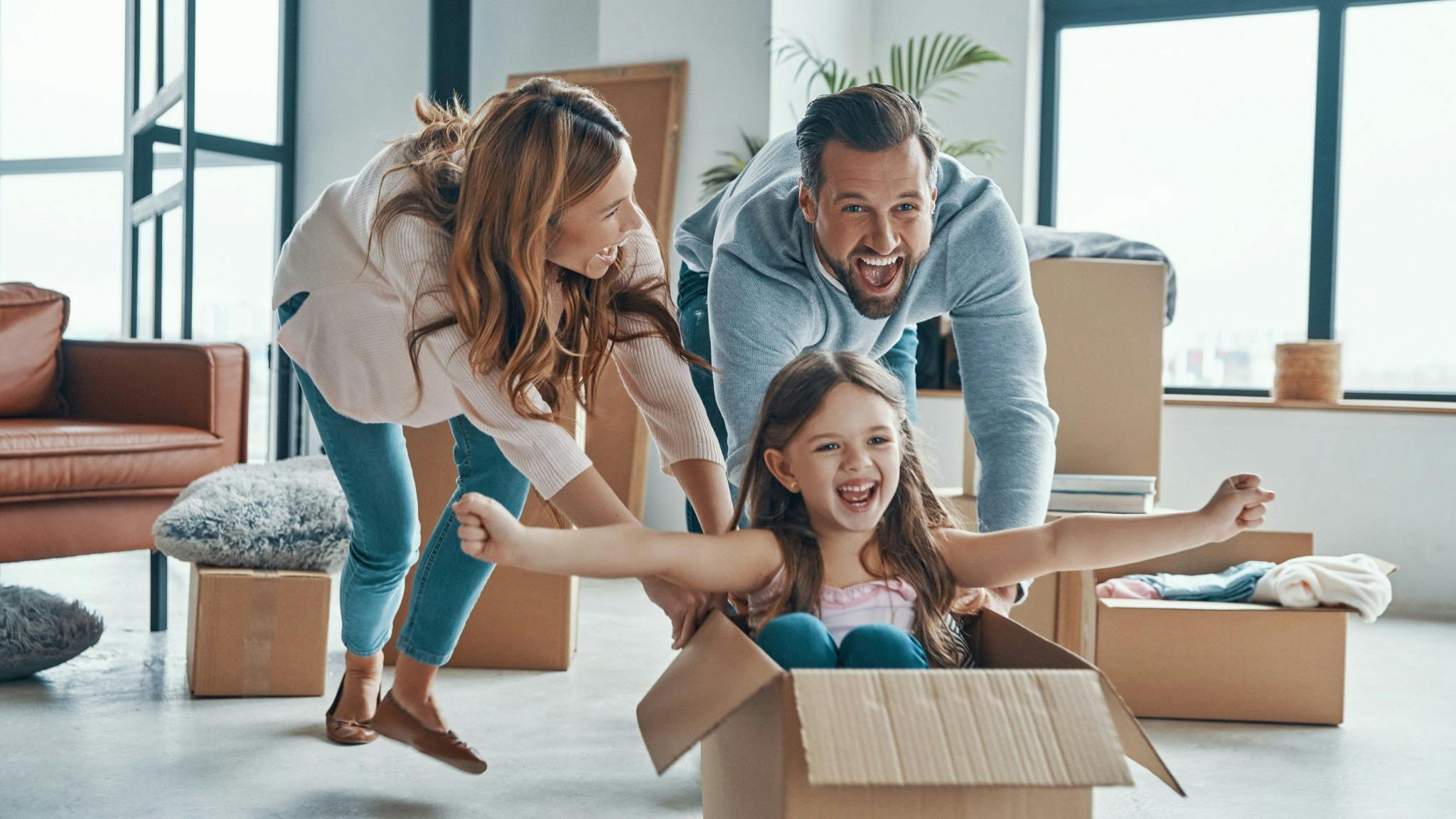 Family enjoying moving in to new house.