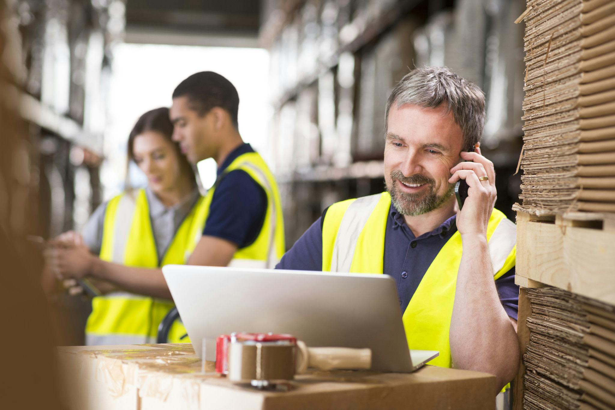 Group of people working in a warehouse.