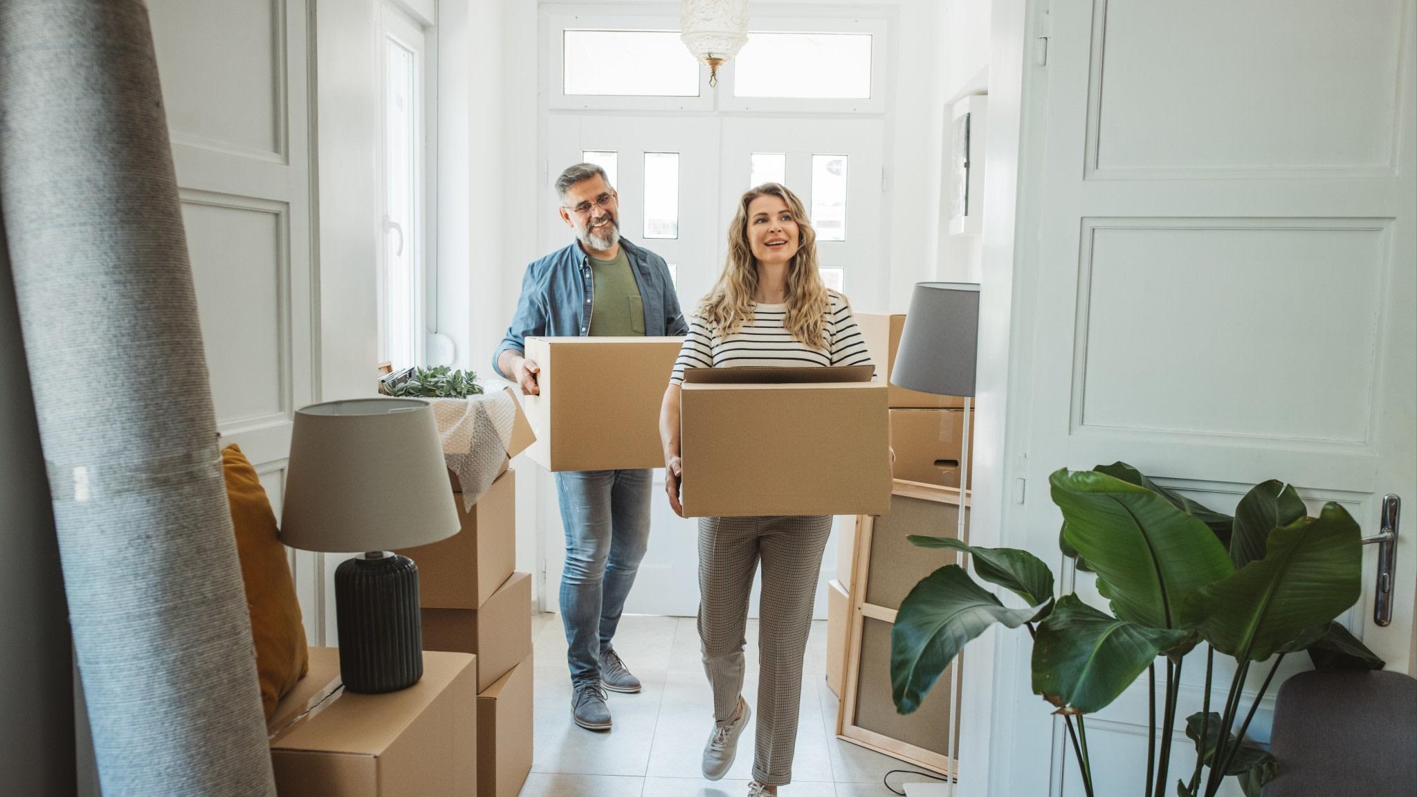 Couple moving in to their new home.